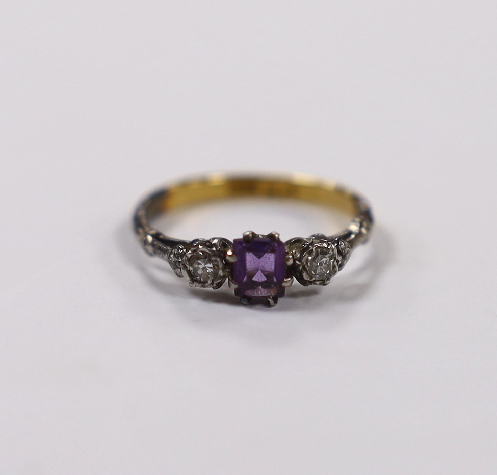 An early 20th century 18ct and plat. single stone amethyst and two stone diamond set ring, size K, gross weight 2.1 grams.